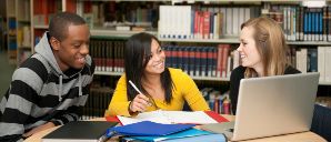 three students in library